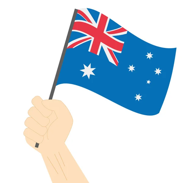 Hand halten und die australische Nationalflagge hissen — Stockvektor