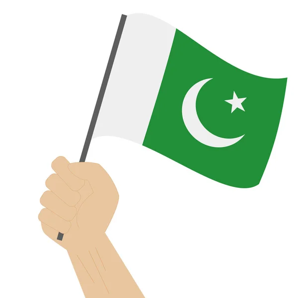 Hand holding and raising the national flag of Pakistan — Stock Vector