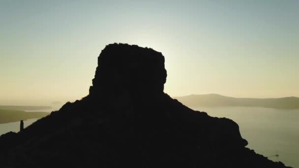 Drone footage from Skaros Rock, Santorini, Greece As The Sun Sets Over The — Stock Video