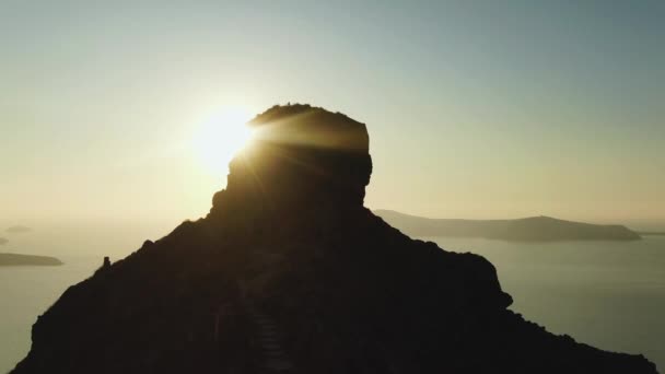 Drone footage from Skaros Rock, Santorini, Greece As The Sun Sets Over The — Stock Video