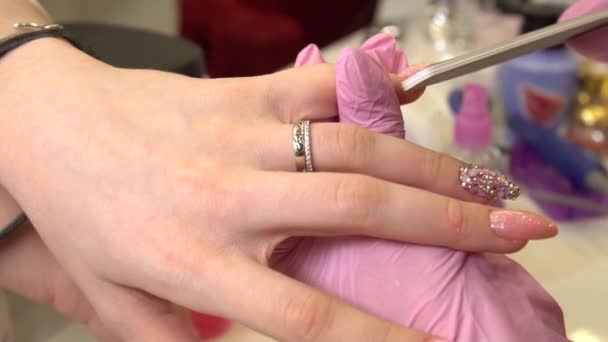 With pink Close Up View, slow motion. Female hands manicure close-up view. Aged lady hand at manicure procedure in spa salon. — 비디오