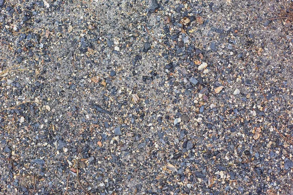 wet earth and small pebbles, texture