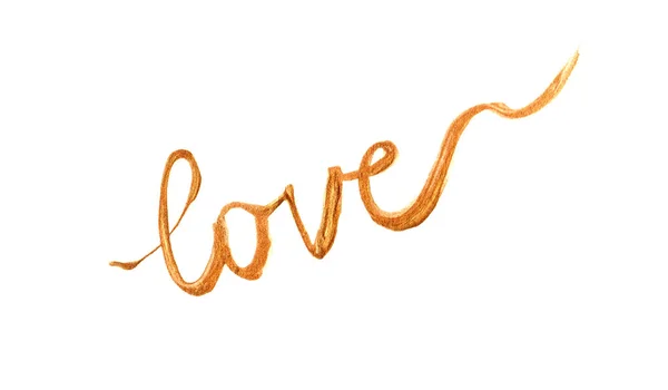 Written word love in gold paint. Isolated on a white background. — Stock Photo, Image