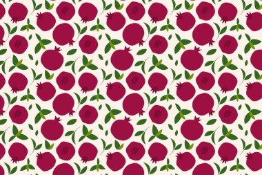 Nar meyvesi ve bej arkaplanda yapraklar