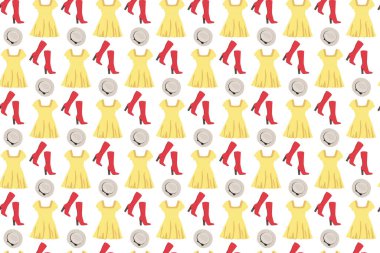 Parlak kıyafet modeli. Beyaz arka planda elbise, şapka ve botlar.