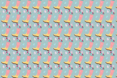 Bahar arka planı. Pembe lastik çizmede çiçekler