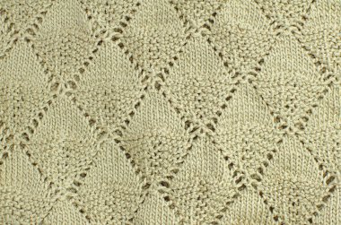 Eşkenar dörtgenlerle örgü dokusu. Bej arkaplan