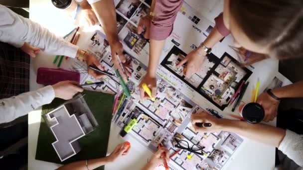 Business, people, architecture and team work concept - close up of architects team hands pointing finger to blueprint at office table 4k — Stock video