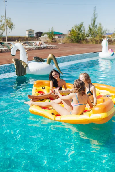 Sexy girls on summer party in the pool