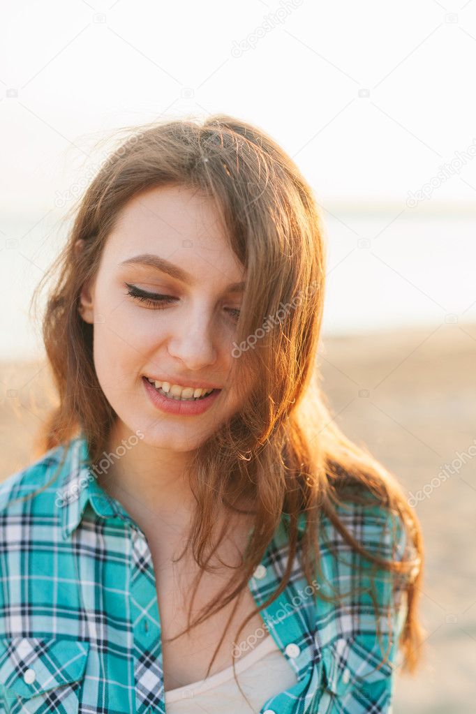 Outdoor portrait, young beautiful woman smiling