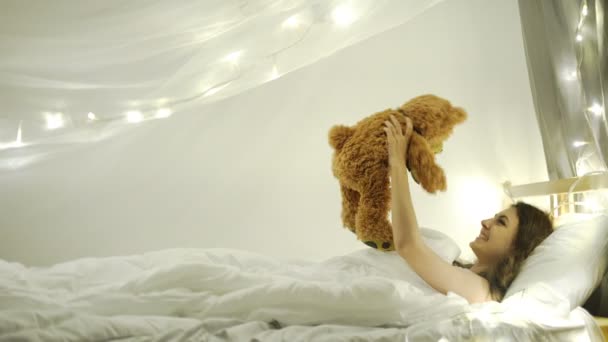 Young woman with teddy bear — Stock Video