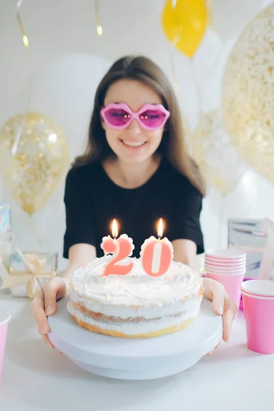 Young woman with cake