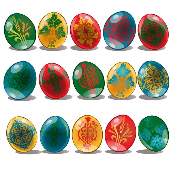 Huevos de Pascua con patrón étnico y floral de color amarillo, rojo, azul, verde. Conjunto de símbolos navideños. Ilustración vectorial aislada sobre fondo blanco — Vector de stock