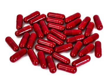 Beyaz bir arka plan üzerinde kırmızı kapsül