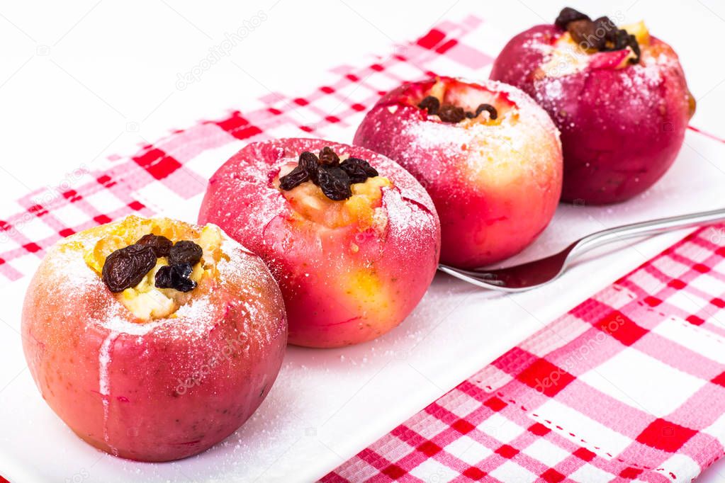 Apples, baked in the oven with honey and raisins