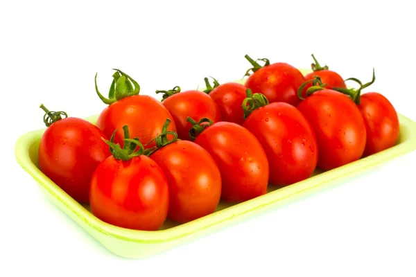 Punainen ja vihreä tomaatti valkoisella taustalla — kuvapankkivalokuva