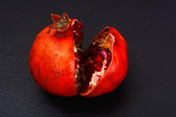 Corn Ripe Pomegranate on dark background. — Stock Photo, Image