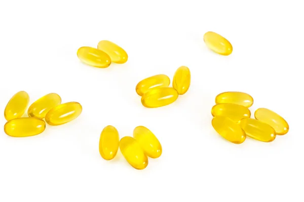 Capsules de vitamine E sur fond blanc — Photo
