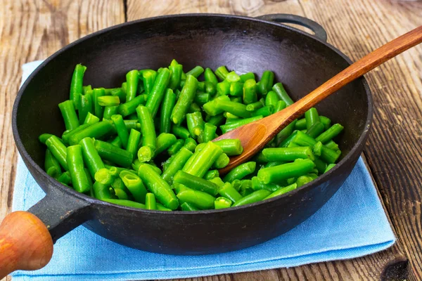 Green Beans on cast-iron frying pan