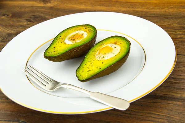 Avocados, Baked with Quail Egg, Salt, Pepper, Lemon