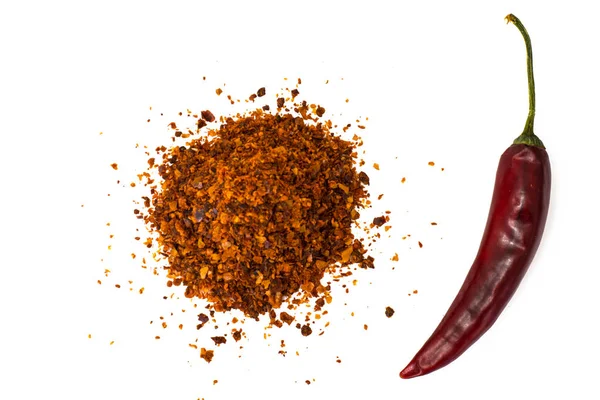 Chili, röd paprika flingor, liktornar och chilipulver — Stockfoto