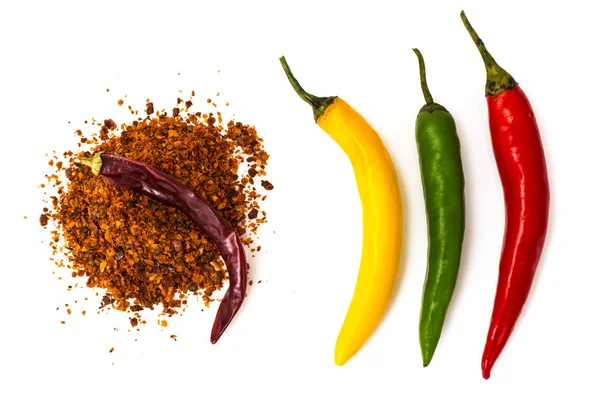 Chili, red pepper flakes, corns and chili powder — Stock Photo, Image