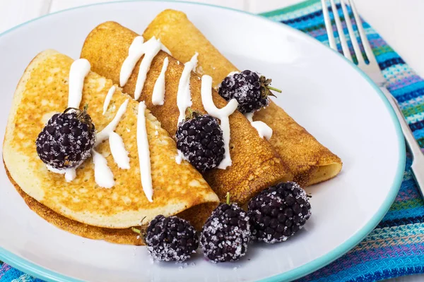 Pancake thin fried with blackberry