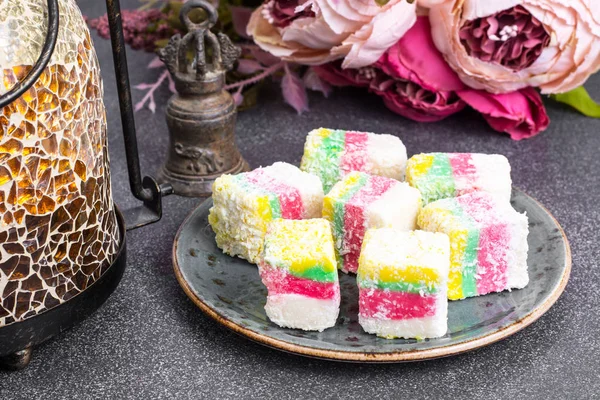 Eastern sweets Turkish delight in color coconut chips — Stock Photo, Image
