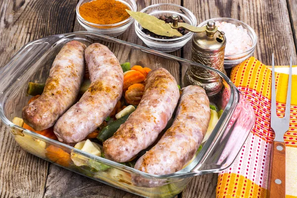 Country sausage with vegetables baked in the shape of glass — Stock Photo, Image