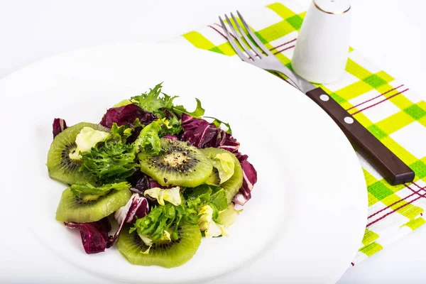 Vegetarian menu- salad of leaf lettuce, kiwi, olive oil