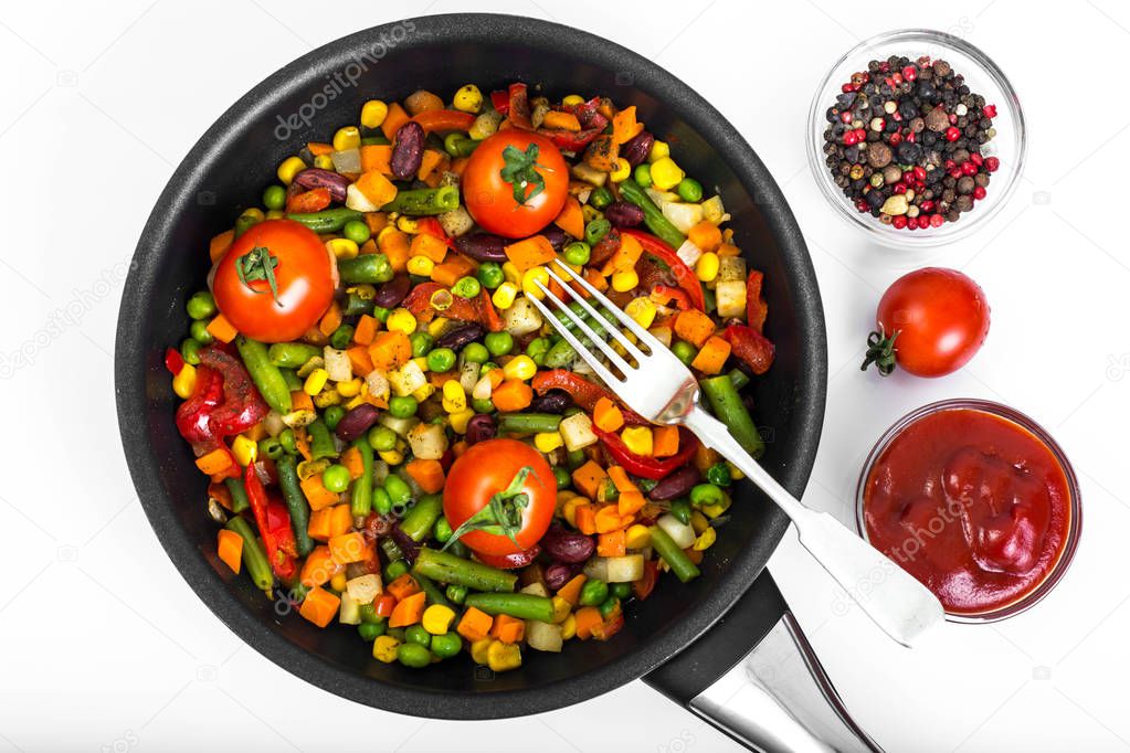 Steamed vegetables with tomatoes in pan