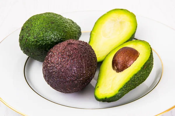 Avocado whole and cut — Stock Photo, Image