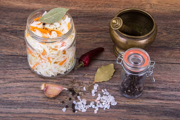 Sauerkraut with carrots in glass jar — Stock Photo, Image