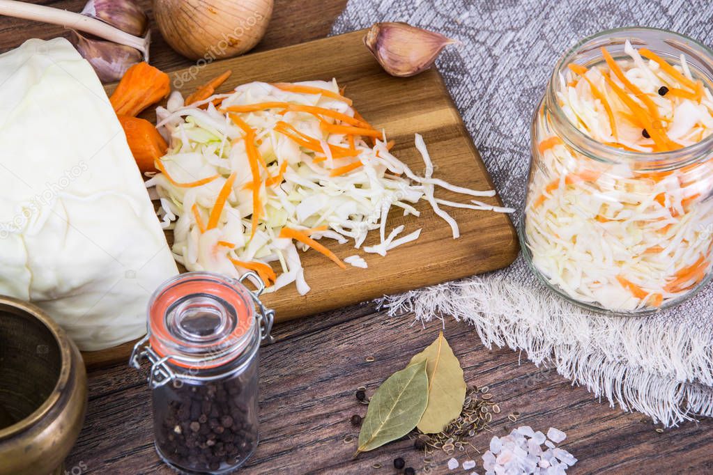 Sauerkraut with carrots in glass jar