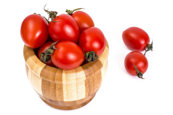 Red tomatoes in wooden salad bowl — Stock Photo, Image