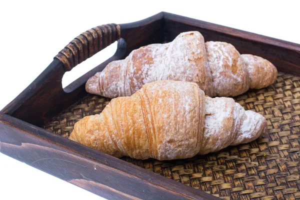 Croissants na bandeja de madeira — Fotografia de Stock