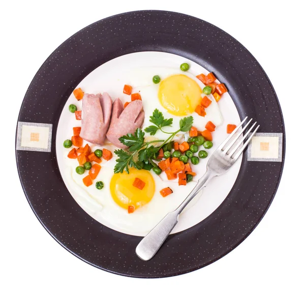 Plate with fried eggs and steamed vegetables for breakfast — Stock Photo, Image