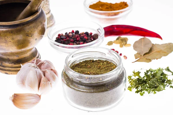 Ground dried herb spices and spices in glass jar — Stock Photo, Image