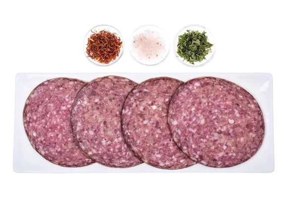 Round slices of chopped sausage on white background — Stock Photo, Image