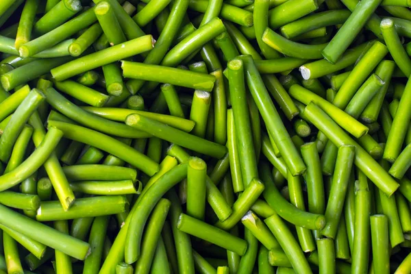 Green chopped pods of beans on white background — Stock Photo, Image