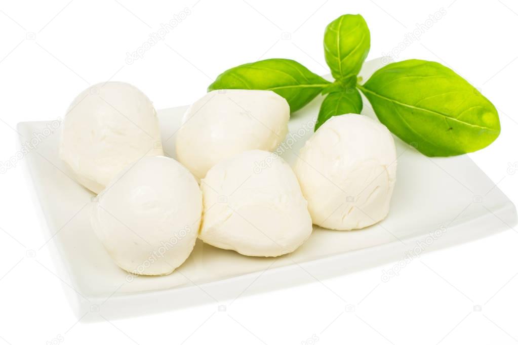 Mozzarella balls on white plate