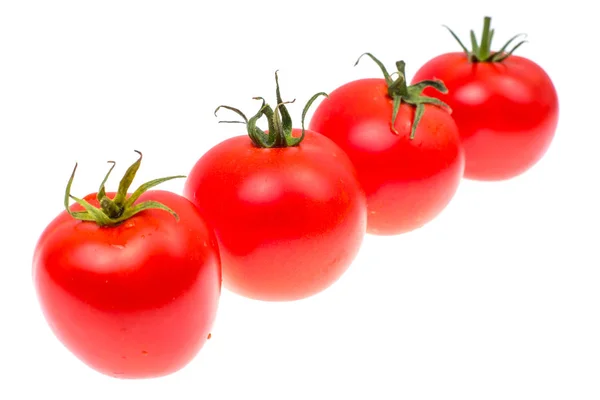 Mehrere rote reife Tomaten isoliert auf weißem Hintergrund — Stockfoto