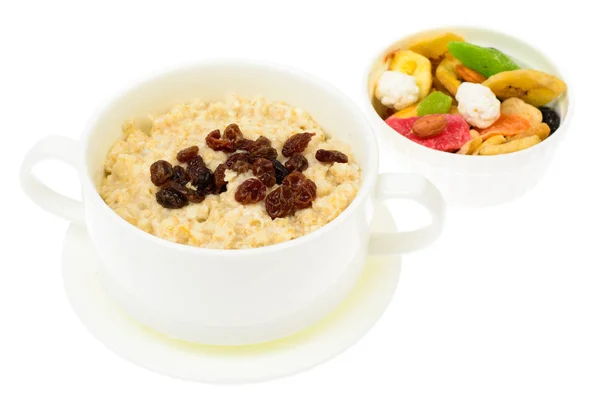 Health and Fitness food. Oatmeal porridge with berries and dried fruits — Stock Photo, Image
