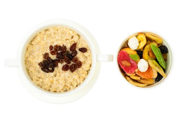 Health and Fitness food. Oatmeal porridge with berries and dried fruits — Stock Photo, Image