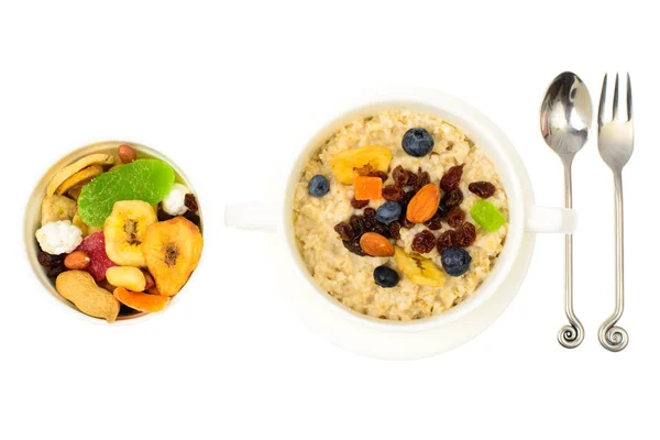 Health and Fitness food. Oatmeal porridge with berries and dried fruits — Stock Photo, Image