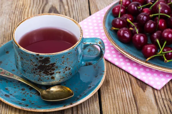 Cherry compote and fresh cherry on plate — Stock Photo, Image