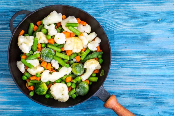 Pan with frozen vegetable mix for frying