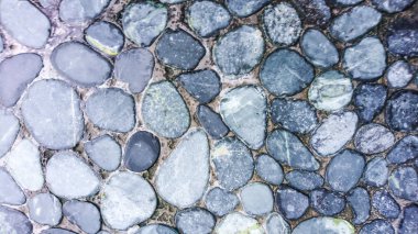 Küçük yuvarlak gri arka plan doku, taşlar