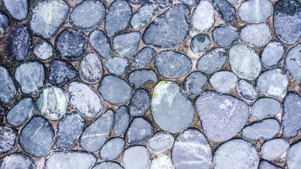 Küçük yuvarlak gri arka plan doku, taşlar