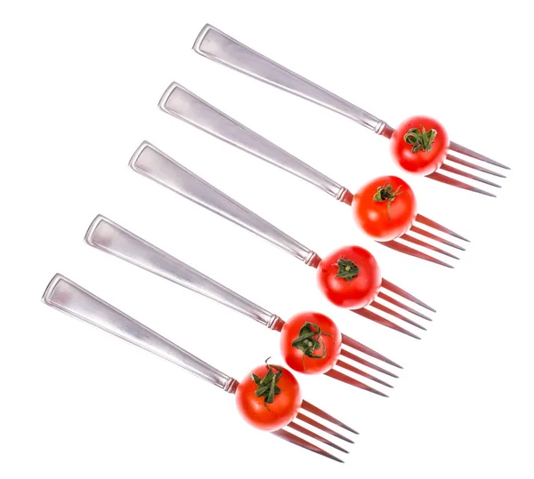 Concept of dietary healthy nutrition. Cherry tomatoes on forks — Stock Photo, Image